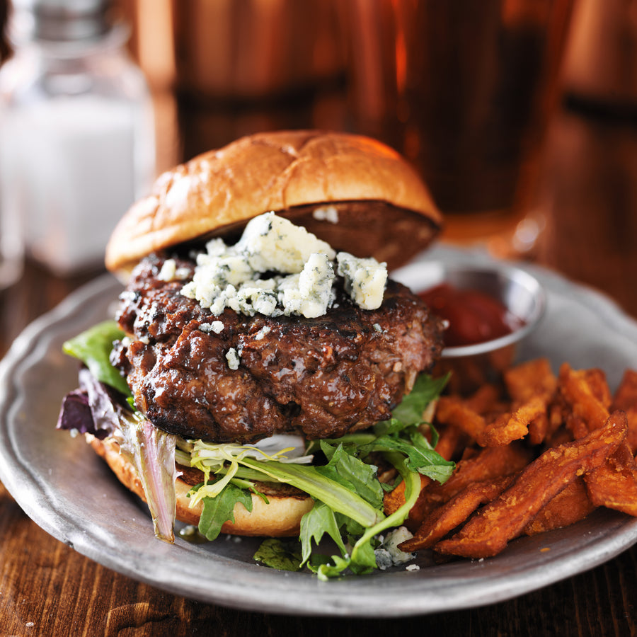 a well prepared burger with sweet potato fries - Pintler Mountain Beef